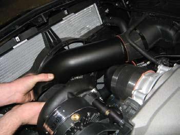 We suggest first sliding the air inlet tube into the supercharger first followed by the
