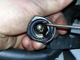 Follow the steps below to properly remove the check ball from the passenger side valve cover fitting and