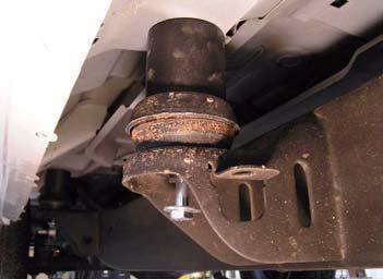 b. Remove bolt and lower bushing from each cab mount on passenger side. Retain factory nut from front core support cab mount. Lower Bushing Cab Mount (Except Core Support) Remove From These Mounts 2.