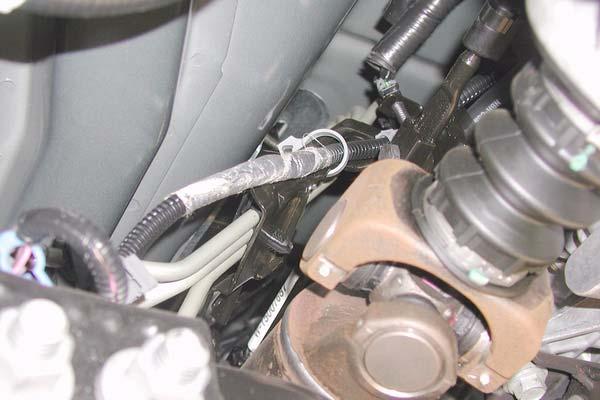 j. Install fuel filler hose clips. Clips c. Remove two nuts and bracket from transfer case. Bracket Nuts k.