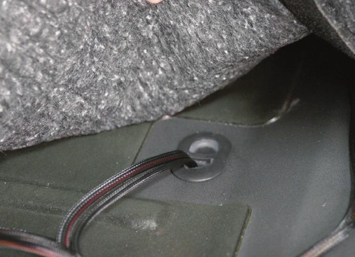 If there is a plug in the floor behind the driver seat, take the driver-side rear actuator (red / black) and the LED light (brown / tan) and route it through the floor plug behind the driver seat.