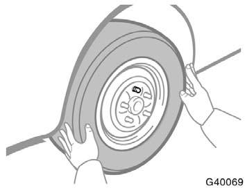 Changing wheels Never get under the vehicle when the vehicle is supported by the jack alone. 7. Remove the wheel nuts and change tires. Lift the flat tire straight off and put it aside.