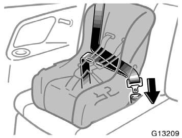 1. Run the lap and shoulder belt through or around the convertible seat following the instructions provided by its manufacturer and insert the tab into the buckle taking care not to twist the belt.