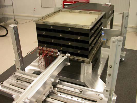 Assembly of the Pre Electronics Module (PEM) for the first flight module is in