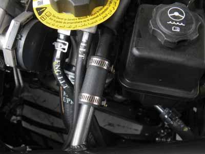 p. In the engine bay, connect the new washer pump extension harness onto the