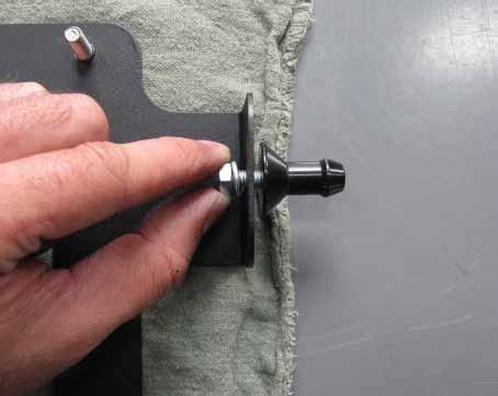 M6 bolt and lock washer provided and fully tighten. b. Mount the washer bottle