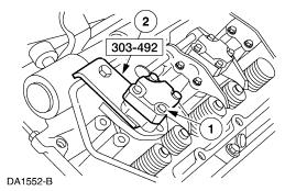 Install the fuel injector. 1. Insert the fuel injector into the cylinder head fuel injector bore. 2.
