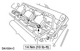Install the fuel injector hold-down bolts. 56. NOTE: All eight oil deflectors are installed the same way. Only one oil deflector is shown. Install the oil deflector. 1. Position the oil deflector. 2.