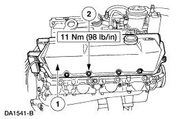 Install the valve cover. 1. Position the valve cover onto the cylinder head. 2. Install the bolts. 62. Install the oil level indicator tube. 1. Position the indicator tube into the oil pan. 2. Position the indicator tube retainer into the stud bolt.