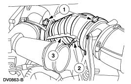 8. NOTE: The Marmon clamp cannot be removed with the turbocharger in place. Loosen the Marmon clamp.