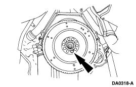 5. NOTE: Use extreme care when removing the flywheel front adapter to prevent damage to