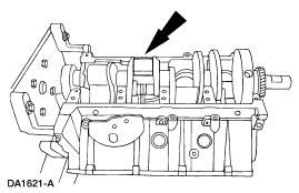 6. Install the crankshaft into the cylinder block. 7. NOTE: Do not turn the crankshaft while performing the main bearing clearance check. Install the special tool 303-D031 (D81L-6002-B). 1.