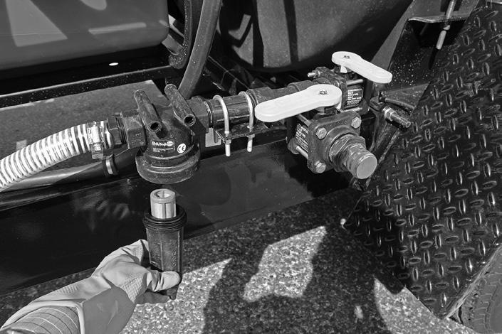 Rubber Plug > Tank > Tee > Figure C1 Wheel With Accu-Lube Hub Maintenance Cleaning the Strainer The Express Hot Pressure Washer Trailer is equipped with a T strainer to filter foreign matter from the