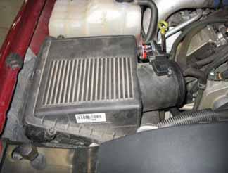 e. The air filter housing is held in place by