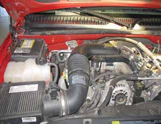 Be sure that the pipes or any other components do not contact any part of the vehicle. Tighten the rubber mount, all bolts, and hose clamps. b. Check for proper hood clearance.