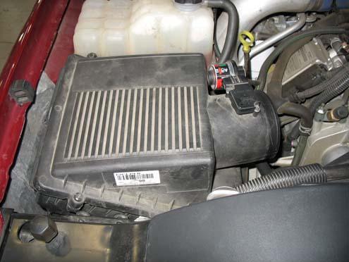 e) The air filter housing is held in plce by two grommets on the