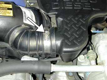 2. Removal of stock system a. On 2001 models, loosen the bolt securing the engine cover, then remove the engine cover.