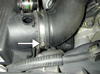 Remove the air box mounting tray by removing the five bolts.