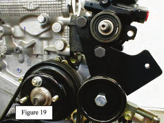 41. Install the supplied idler pulley bracket to the front of the power steering pump. See Figure 19. Note PS pulley is removed for photos only. Use (2) 10mm x 1.25 x 100mm long bolts supplied.