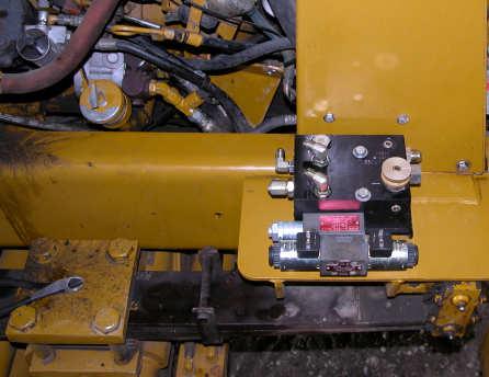 Remove the two bolts furthest from the cab. D Figure 1. Prepared Automated Steering Block. bolts B C c.