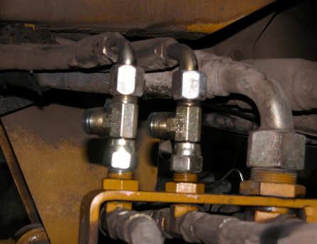 ) G Figure 5b. Installed run tees. d. Reattach the steering lines to the ends of the run tees. (Figure 5c.