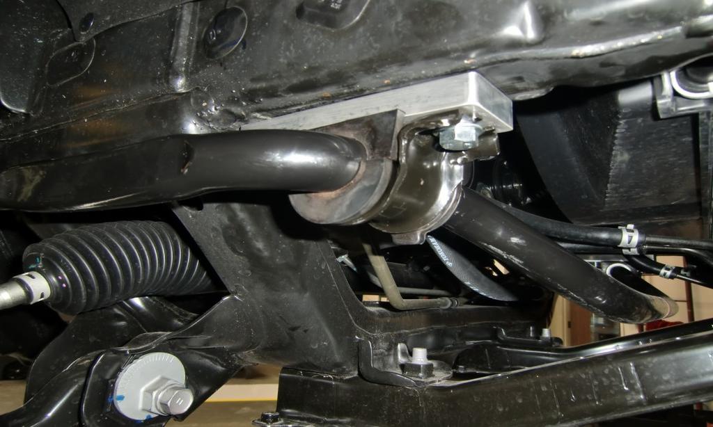 Torque the upper control arm and lower strut hardware to 125 ft-lbs, and the upper strut hardware to 30 ft-lbs.