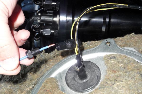 Using a blunt object, carefully puncture a hole for the included 10AWG red wire to pass through while maintaining a weather tight seal.