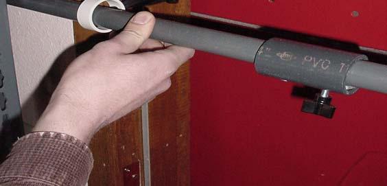 Use plastic tri-lobe nut to screw panel snug to doorframe.