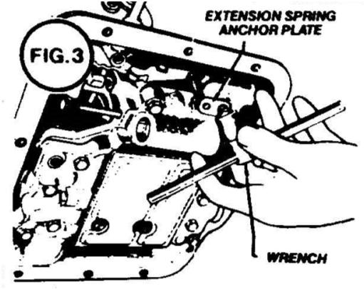 Use hacksaw to cut protruding part of the transmission away to allow cable bracket installation. Clean all metal chips away from the transmission before removing the oil pan. Remove all stock linkage.