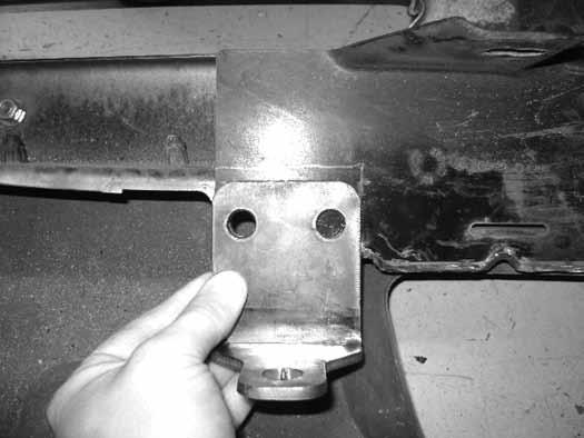Figure 21 45. Drill a 7/16" hole at the marks made. Attach the new brackets to the bumper with the provided 7/16" x 1-1/4" bolts, nuts and washers.