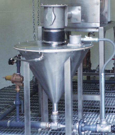 An Acrison Volumetric Feeder is used to meter a dry chemical into a Dissolving Tank.