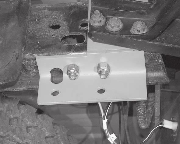 Install one 1/2 x 1-3/4 carriage bolt from top down, backing plate and 1/2 locknut per side. (See Figure 6.