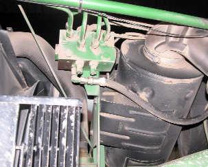 1) On top of the tractor steering valve are the pressure, right, and left input connections.