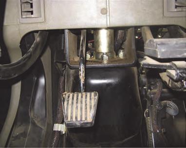 Installation - Steering Wheel Switch (SWS) 1. Install the steering wheel switch. a. Locate the steering shaft under the steering console near the cab floor.