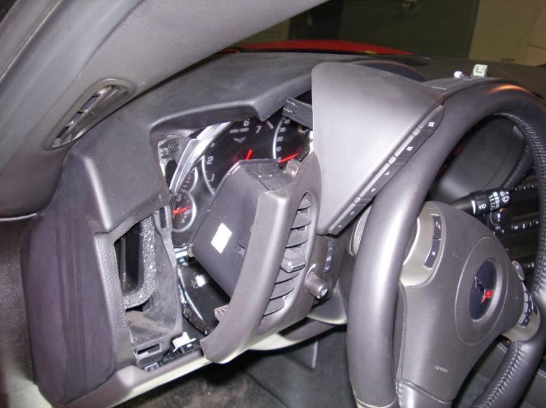 Figure 8: Removal of gauge cluster trim 10. Remove the instrument display buttons from the driver side by removing the 3 screws holding it in place.