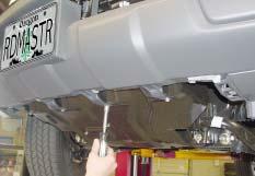 Start by removing three plastic fasteners located behind the grille,