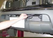 9. Remove three plastic fasteners located along the upper edge of the lower grille opening (Fig.I). Fig.I 10.