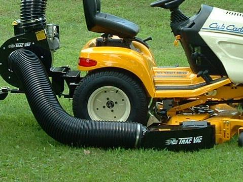 To mount the discharge chute, it is sometimes necessary to remove the deflector shield or lift it out of the way. Place chute adapter on mower deck.