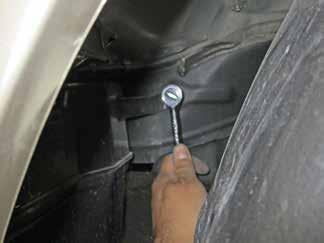 Remove the clips securing the wheel well liner to the