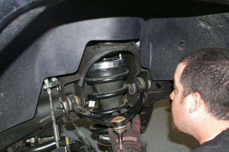 Install the completed strut assembly into the vehicle using the provided M10 flange nuts.
