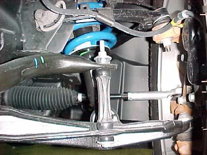 SUPPORT THE LOWER CONTROL ARM AND REMOVE THE SWAY BAR CONNECTING LINK FROM THE SWAY BAR AND LOWER CONTROL ARM ON BOTH SIDES OF THE VEHICLE, SAVE HARDWARE.