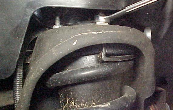 9. LOOSEN THE UPPER THREE OUTER NUTS ATTACHING THE STRUT ASSEMBLY TO THE VEHICLE FRAME. IT IS NOT NECESSARY TO REMOVE THESE NUTS. DO NOT LOOSEN THE CENTER STRUT TO UPPER MOUNT NUT.