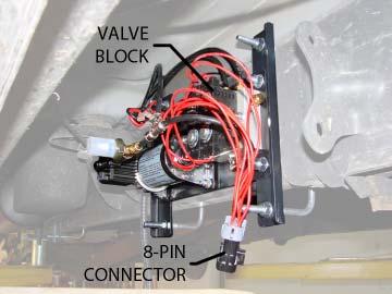 If the LED is not illuminated, adjust the threaded rod and sensor linkage until the LED is glowing. Finally, plug the 8-pin connector from the wire harness into the valve block. See Figure T.