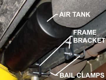 Mount the tank assembly to the passenger side frame rail using two bail clamps and four 3/8"-16 flange nuts. It should be located on the outside of the frame rail just forward of the fender well.