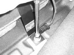20. The lower bracket attaches to the studs behind the lower seat cushion.