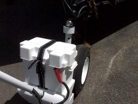 With your trailer jack, lower the trailer down onto the ball and lock it as you normally would.