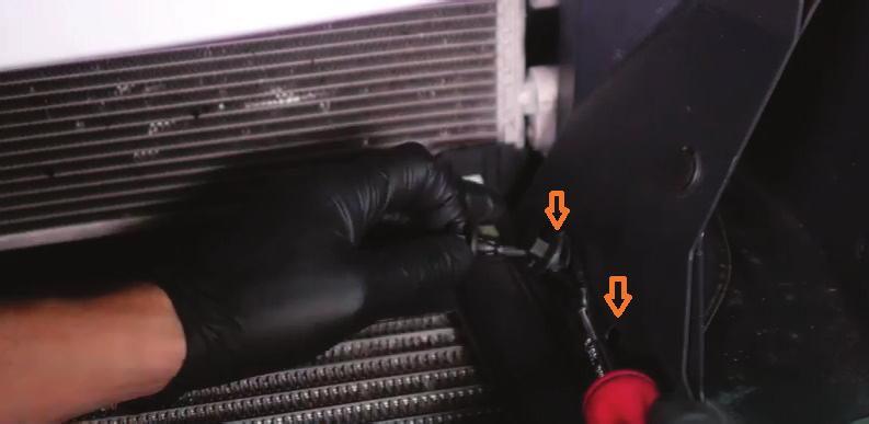 Remove the two pop-clips that secure the air diverter to the ducting.