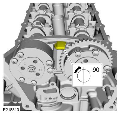 Using a wrench on the flats of the camshaft, have an assistant rotate the intake camshaft counterclockwise until the locating pin of