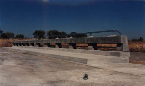 The fifth system, the Type 80SW, as shown in Figure 7, consisted of a single 12 tubular pedestrian handrail mounted atop an aesthetic, see-through concrete bridge rail with a 8.9 in.