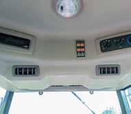 fully-enclosed cab with heat/ac, front and rear work lights, rear wiper, audio system standard Work lights and rear remotes standard on all models 4WD with differential lock, category I 3-pt.